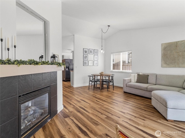 839 Avalon Ct SE, Olympia, WA 98513 - living area featuring lofted ceiling, wood finished floors, and a tiled fireplace