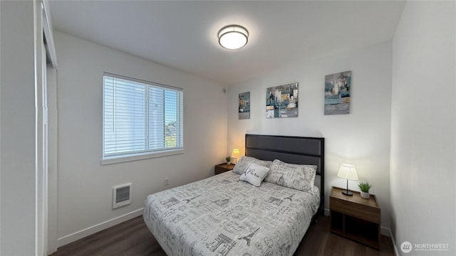 890 Magellan Ave NE Unit 3, Ocean Shores, WA 98569 - bedroom with dark wood-style floors and heating unit