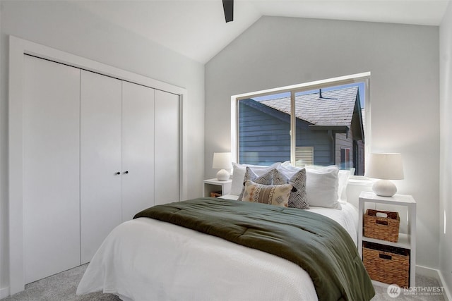 5929 California Ave SW Unit B, Seattle, WA 98136 - bedroom featuring carpet flooring, vaulted ceiling, a closet, and ceiling fan