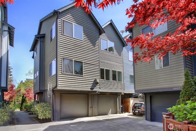 5929 California Ave SW Unit B, Seattle, WA 98136 - back of property featuring an attached garage and driveway