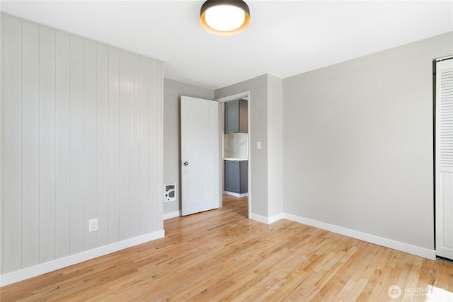 19410 10th Ave S, Des Moines, WA 98148 - spare room featuring baseboards and light wood-style flooring