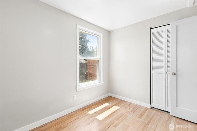 19410 10th Ave S, Des Moines, WA 98148 - unfurnished bedroom with light wood-type flooring and a closet