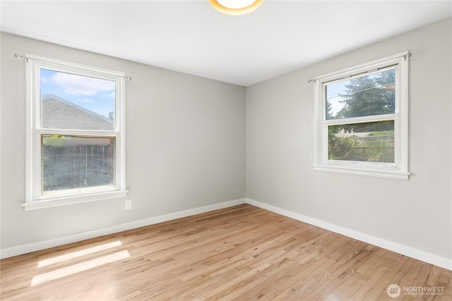 19410 10th Ave S, Des Moines, WA 98148 - unfurnished room featuring wood finished floors and baseboards