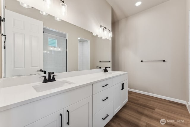 5801 SW Thornhill Ave SW Unit 323, Port Orchard, WA 98367 - bathroom featuring double vanity, wood finished floors, and recessed lighting