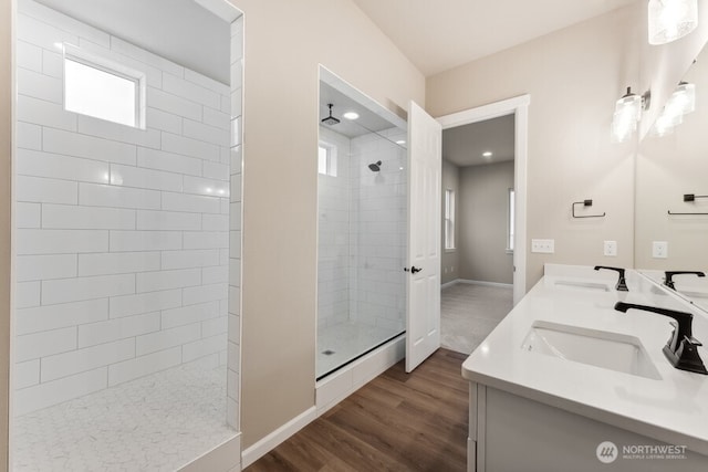 5801 SW Thornhill Ave SW Unit 323, Port Orchard, WA 98367 - bathroom with healthy amount of natural light, a walk in shower, wood finished floors, and double vanity
