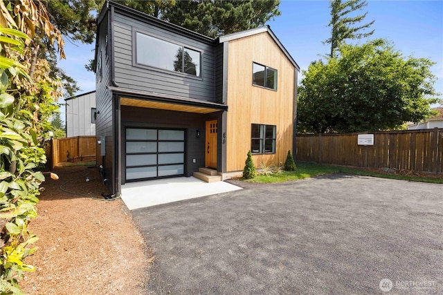 826 NE 95th St, Seattle, WA 98115 - contemporary home with asphalt driveway and a garage