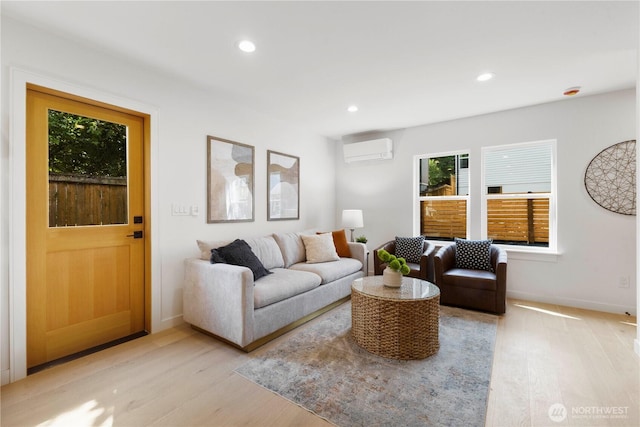 826 NE 95th St, Seattle, WA 98115 - living room featuring a wall mounted air conditioner, light wood-type flooring, and recessed lighting