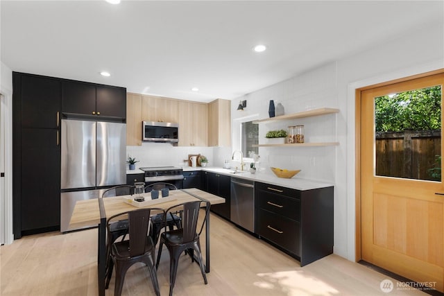 826 NE 95th St, Seattle, WA 98115 - kitchen featuring appliances with stainless steel finishes, dark cabinetry, light countertops, backsplash, and recessed lighting