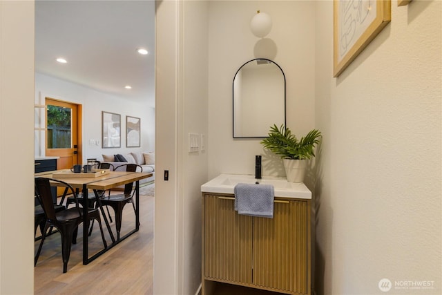 826 NE 95th St, Seattle, WA 98115 - ensuite bathroom featuring wood finished floors, recessed lighting, and vanity