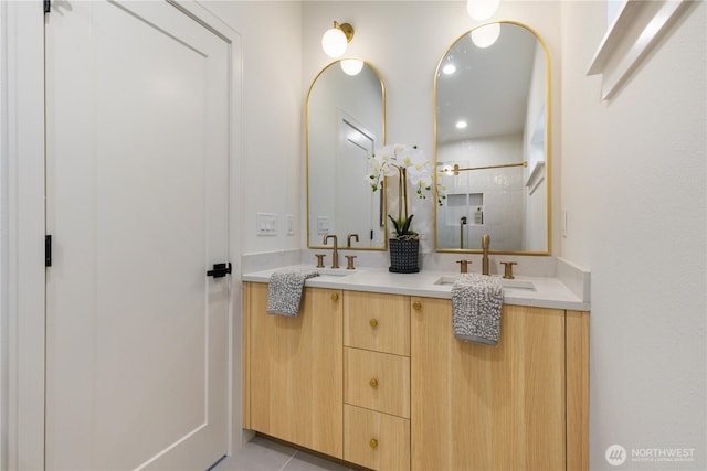 826 NE 95th St, Seattle, WA 98115 - bathroom featuring double vanity, a tile shower, and recessed lighting