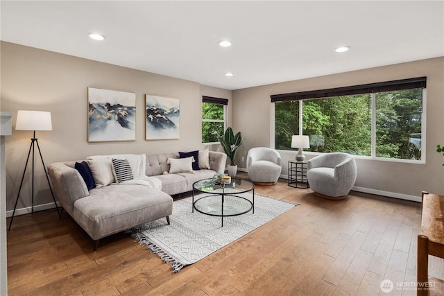 1600 11th Ave S, Seattle, WA 98134 - living room featuring wood finished floors and recessed lighting