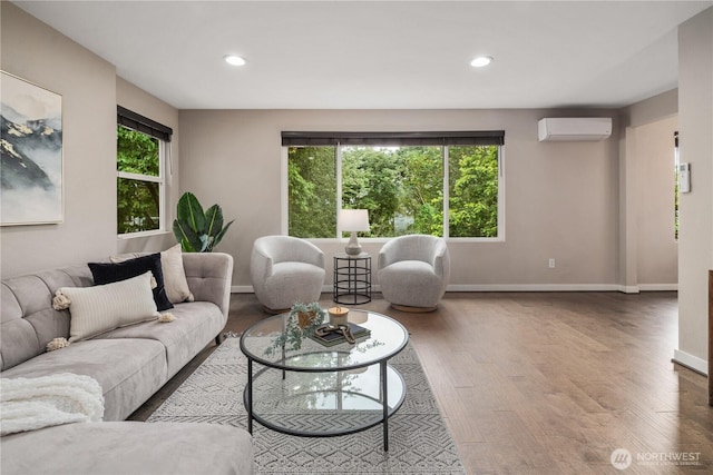 1600 11th Ave S, Seattle, WA 98134 - living area with a wall mounted AC, wood finished floors, and recessed lighting