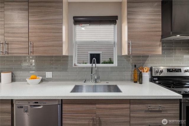 1600 11th Ave S, Seattle, WA 98134 - kitchen featuring appliances with stainless steel finishes, decorative backsplash, and light countertops