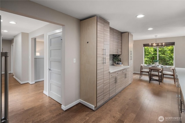 1600 11th Ave S, Seattle, WA 98134 - kitchen featuring dark wood-style floors, recessed lighting, light countertops, a chandelier, and modern cabinets