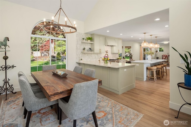 43936 SE 127th Pl, North Bend, WA 98045 - dining area with a chandelier, light wood-style floors, recessed lighting, and lofted ceiling