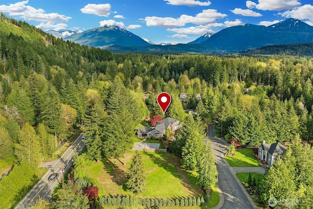 43936 SE 127th Pl, North Bend, WA 98045 - bird's eye view of a heavily wooded area and a mountain backdrop