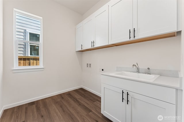 5781 SW Thornhill Ave SW Unit 324, Port Orchard, WA 98367 - laundry room with hookup for a washing machine, hookup for an electric dryer, dark wood-type flooring, and cabinet space