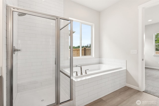 5781 SW Thornhill Ave SW Unit 324, Port Orchard, WA 98367 - full bath with a shower stall, a bath, and wood finished floors