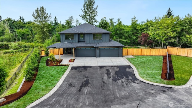 30408 SE 304th St, Auburn, WA 98038 - modern home featuring driveway, board and batten siding, a garage, and a shingled roof