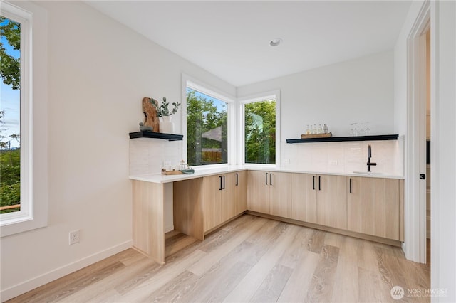30408 SE 304th St, Auburn, WA 98038 - indoor wet bar with light wood-type flooring and baseboards