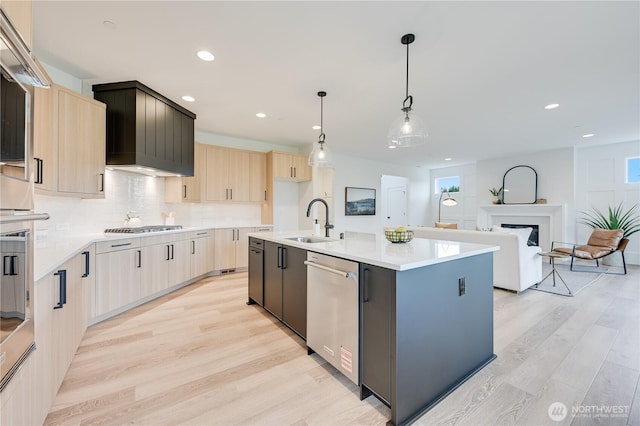 30408 SE 304th St, Auburn, WA 98038 - kitchen featuring appliances with stainless steel finishes, light brown cabinets, light wood finished floors, light countertops, and recessed lighting