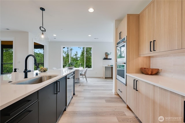 30408 SE 304th St, Auburn, WA 98038 - kitchen with stainless steel appliances, light brown cabinetry, light countertops, light wood finished floors, and recessed lighting