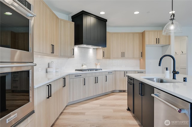 30408 SE 304th St, Auburn, WA 98038 - kitchen featuring light brown cabinets, appliances with stainless steel finishes, light countertops, pendant lighting, and tasteful backsplash
