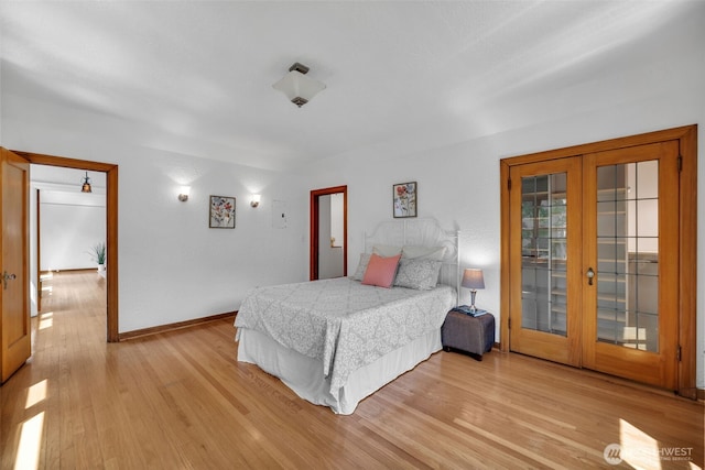 519 W Roy St Unit 211, Seattle, WA 98119 - bedroom with french doors, light wood-style floors, and access to exterior