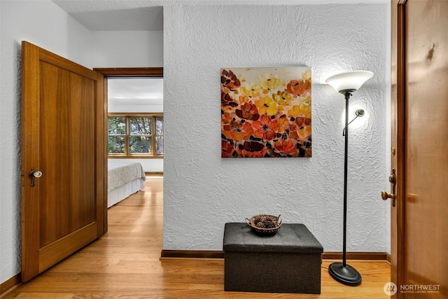 519 W Roy St Unit 211, Seattle, WA 98119 - hall featuring wood finished floors and a textured wall