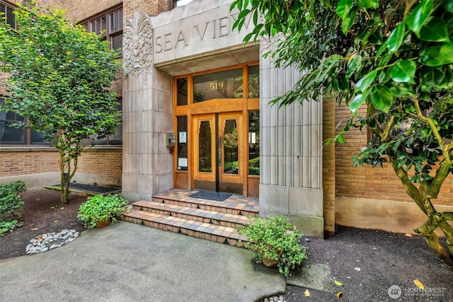 519 W Roy St Unit 211, Seattle, WA 98119 - doorway to property featuring french doors and brick siding