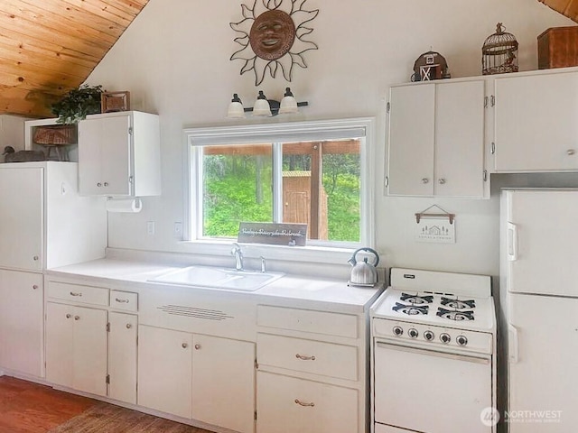 6 Lone Pine Trl, Riverside, WA 98849 - kitchen with white gas range, lofted ceiling, wooden ceiling, light countertops, and light wood-type flooring