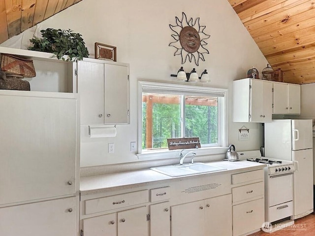 6 Lone Pine Trl, Riverside, WA 98849 - kitchen featuring white appliances, vaulted ceiling, wood ceiling, light countertops, and white cabinets