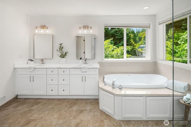 16432 SE 24th St, Bellevue, WA 98008 - full bathroom with double vanity, healthy amount of natural light, and a bath