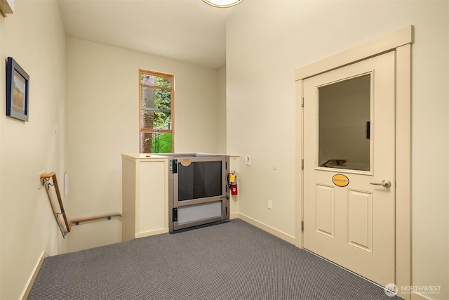 842 Washington St Unit 204, Port Townsend, WA 98368 - empty room with dark colored carpet and baseboards