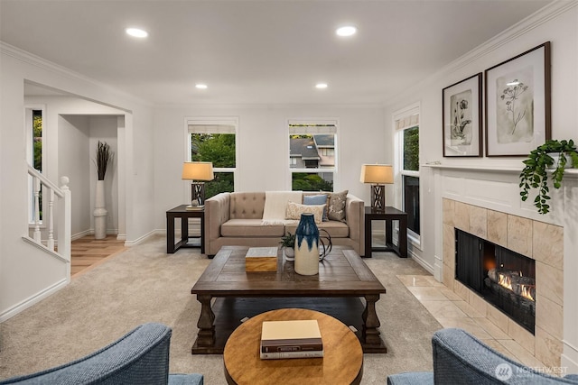 12810 SE 22nd Pl, Bellevue, WA 98005 - living area featuring a tiled fireplace, light carpet, healthy amount of natural light, ornamental molding, and recessed lighting