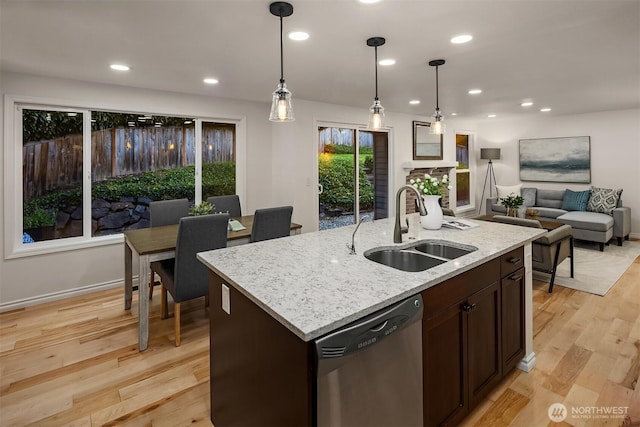 12810 SE 22nd Pl, Bellevue, WA 98005 - kitchen with stainless steel dishwasher, hanging light fixtures, open floor plan, dark brown cabinets, and light wood finished floors