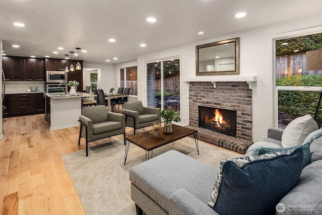 12810 SE 22nd Pl, Bellevue, WA 98005 - living area featuring recessed lighting, light wood finished floors, and a fireplace