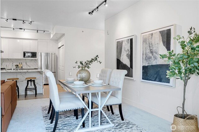 7800 SE 27th St Unit 302, Mercer Island, WA 98040 - dining room featuring track lighting and light carpet