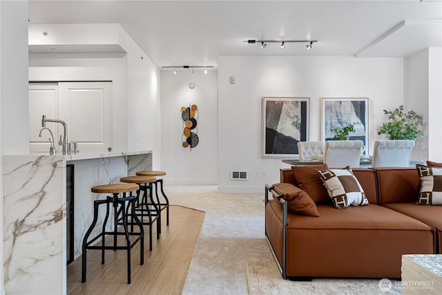 7800 SE 27th St Unit 302, Mercer Island, WA 98040 - living room with track lighting and light colored carpet