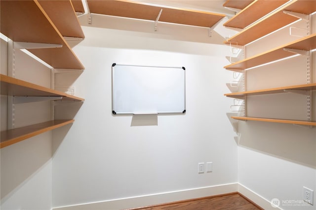 7800 SE 27th St Unit 302, Mercer Island, WA 98040 - spacious closet featuring wood finished floors