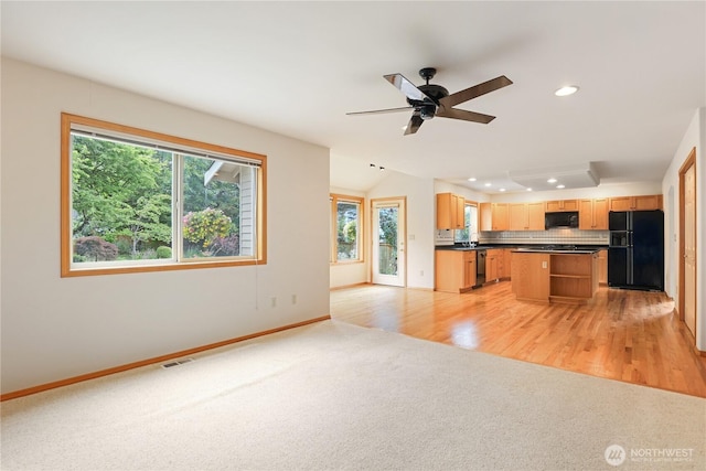 2804 18th St SE, Puyallup, WA 98374 - kitchen featuring black appliances, light carpet, dark countertops, open shelves, and a ceiling fan
