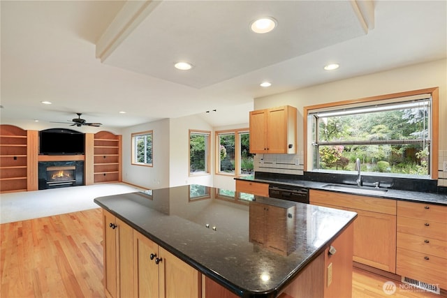 2804 18th St SE, Puyallup, WA 98374 - kitchen featuring dishwasher, a kitchen island, a fireplace, light wood-style flooring, and recessed lighting
