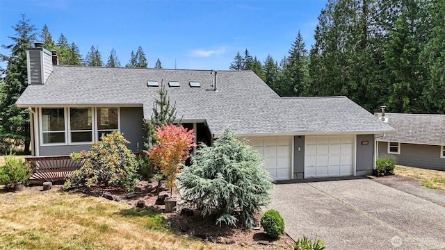 6511 Canyon Ct SW, Olympia, WA 98512 - view of front of property featuring roof with shingles, a garage, a chimney, and concrete driveway