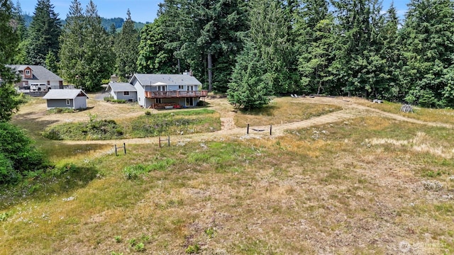 6511 Canyon Ct SW, Olympia, WA 98512 - view of yard with a deck and a view of trees