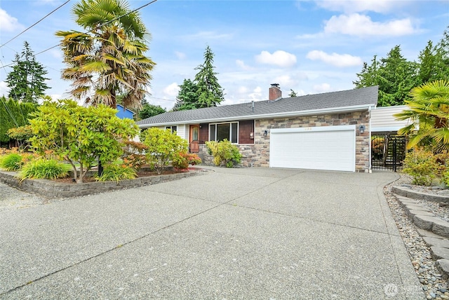 832 Birch St, Edmonds, WA 98020 - view of front of property featuring stone siding, concrete driveway, an attached garage, and a chimney