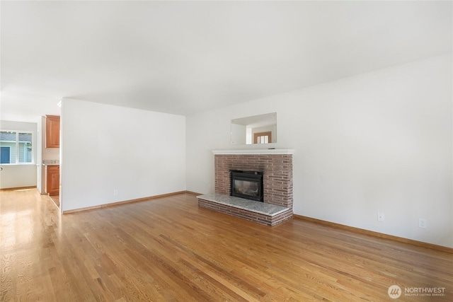 832 Birch St, Edmonds, WA 98020 - unfurnished living room featuring light wood-type flooring and a fireplace