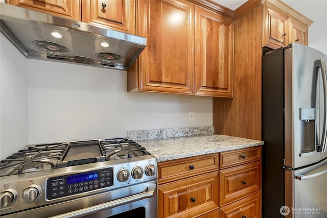 832 Birch St, Edmonds, WA 98020 - kitchen with appliances with stainless steel finishes, ventilation hood, light stone countertops, and brown cabinets