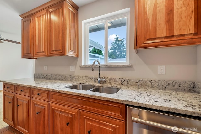 832 Birch St, Edmonds, WA 98020 - kitchen featuring stainless steel dishwasher, brown cabinets, light stone countertops, and a ceiling fan