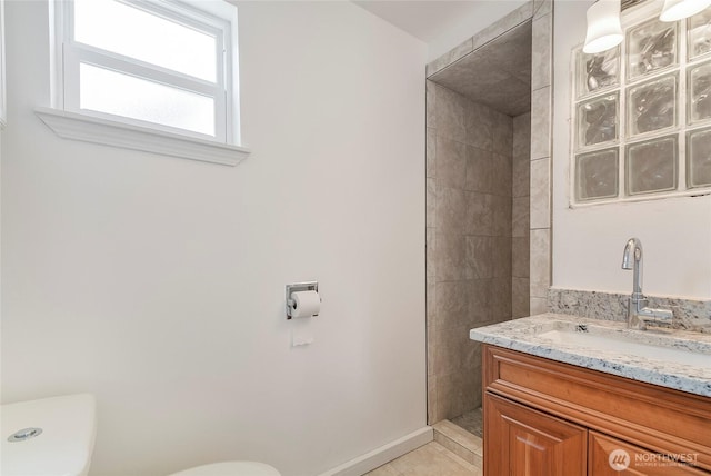 832 Birch St, Edmonds, WA 98020 - bathroom with vanity, tiled shower, and tile patterned flooring