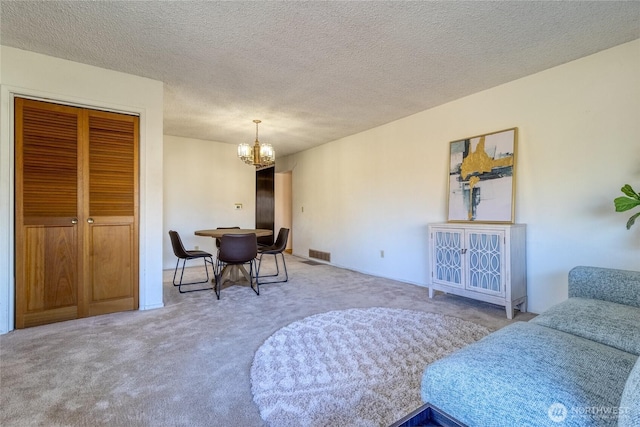 913 Woodlawn, Walla Walla, WA 99362 - carpeted dining space featuring a chandelier and a textured ceiling